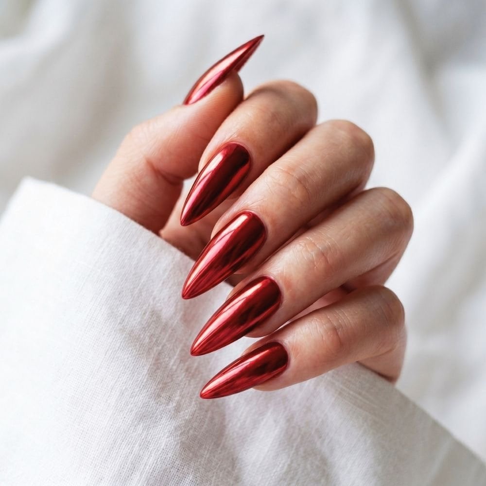 red chrome stiletto nails , white background