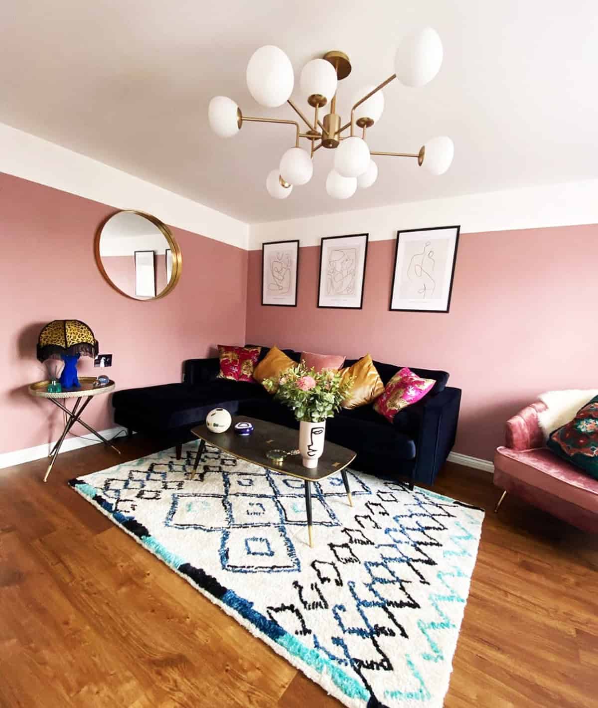 dusky rose walls in an eclectic living room with navy velvet sofa and gallery wall pink wallpaper ideas home decor