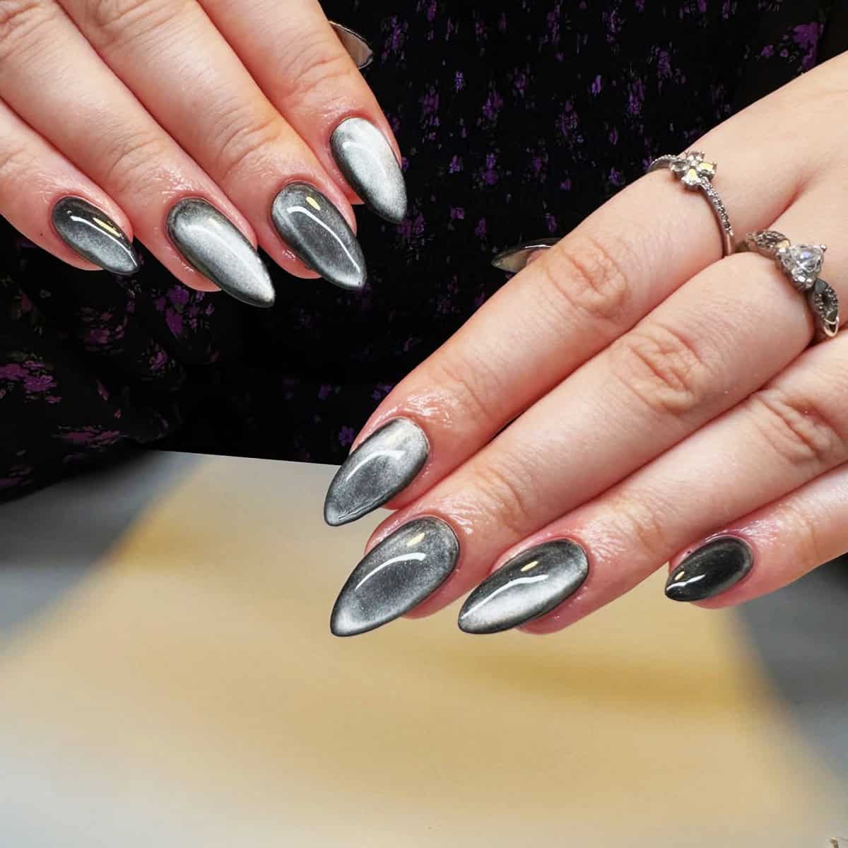 smoky gradient black chrome almond nails with glossy finish black chrome nails