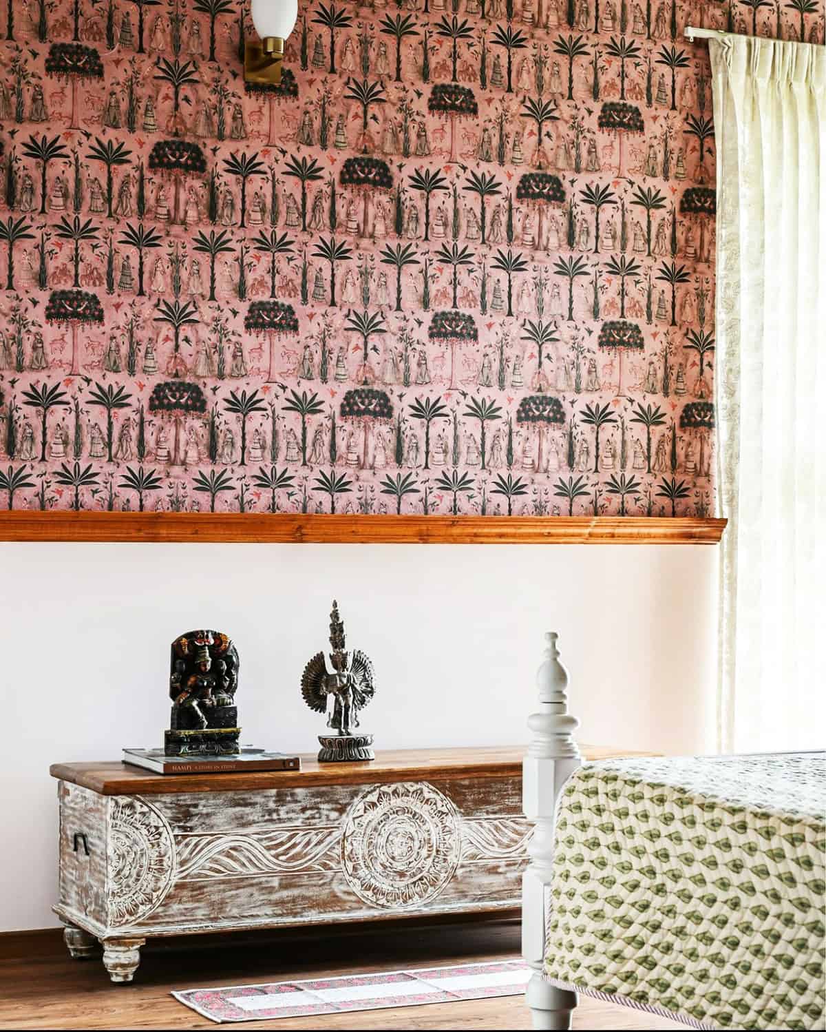 Indian-inspired figurative print wallpaper on blush pink background in a bedroom  pink wallpaper ideas home decor