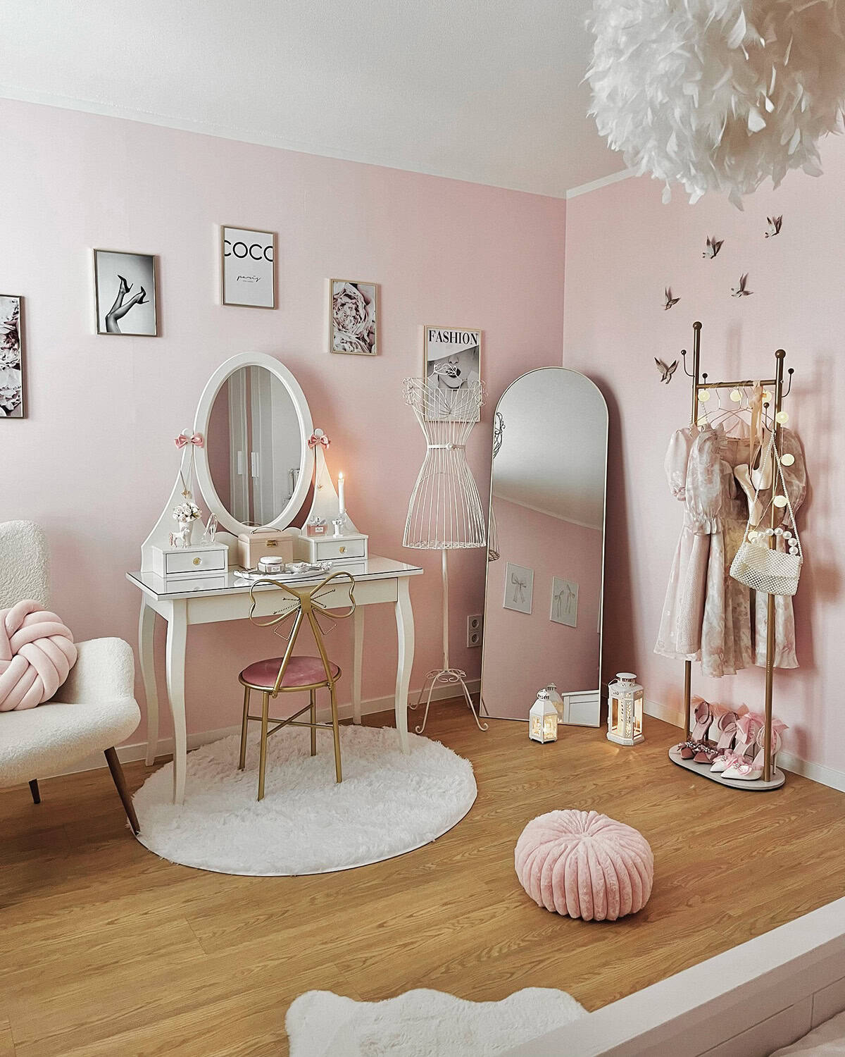 pale pink bedroom dressing area with white vintage vanity fashion prints pink wallpaper ideas home decor