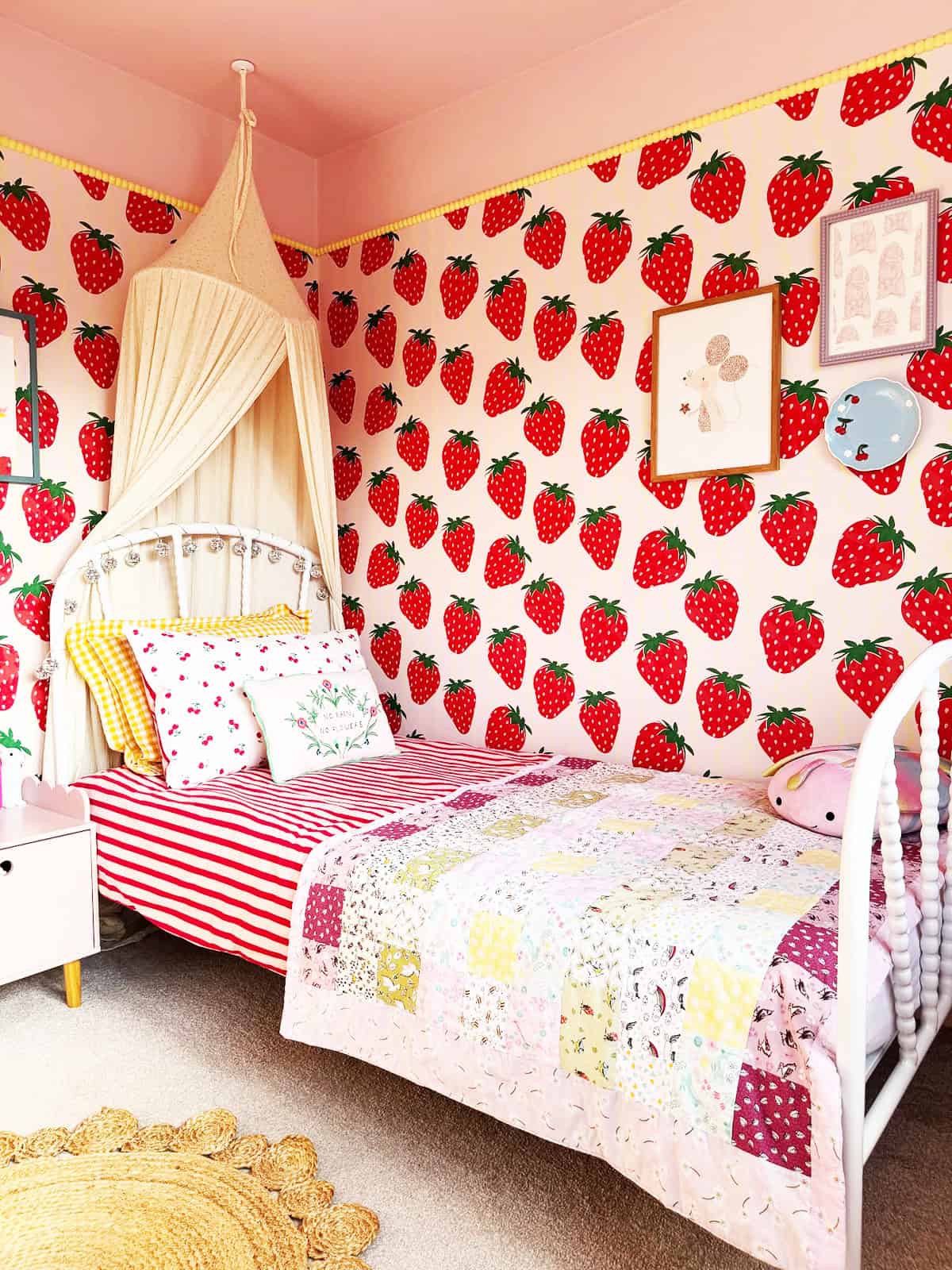 bold strawberry print wallpaper in a bright pink kids bedroom pink wallpaper ideas home decor