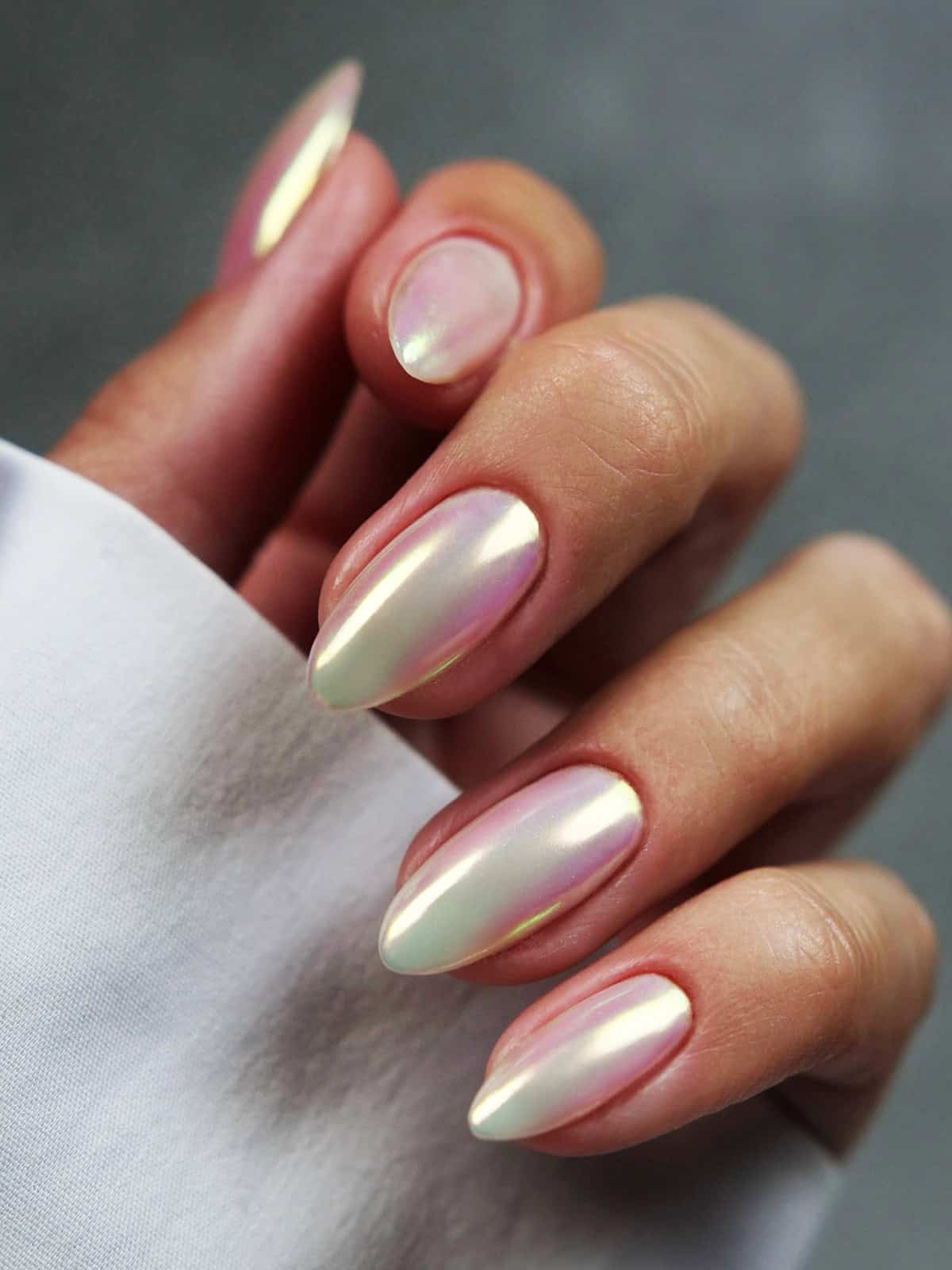 almond nails with opalescent iridescent white chrome nails
