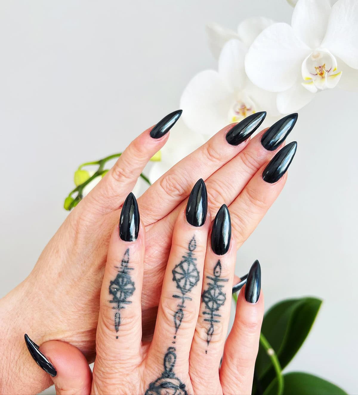 long stiletto glossy black chrome nails sleek and edgy black chrome nails