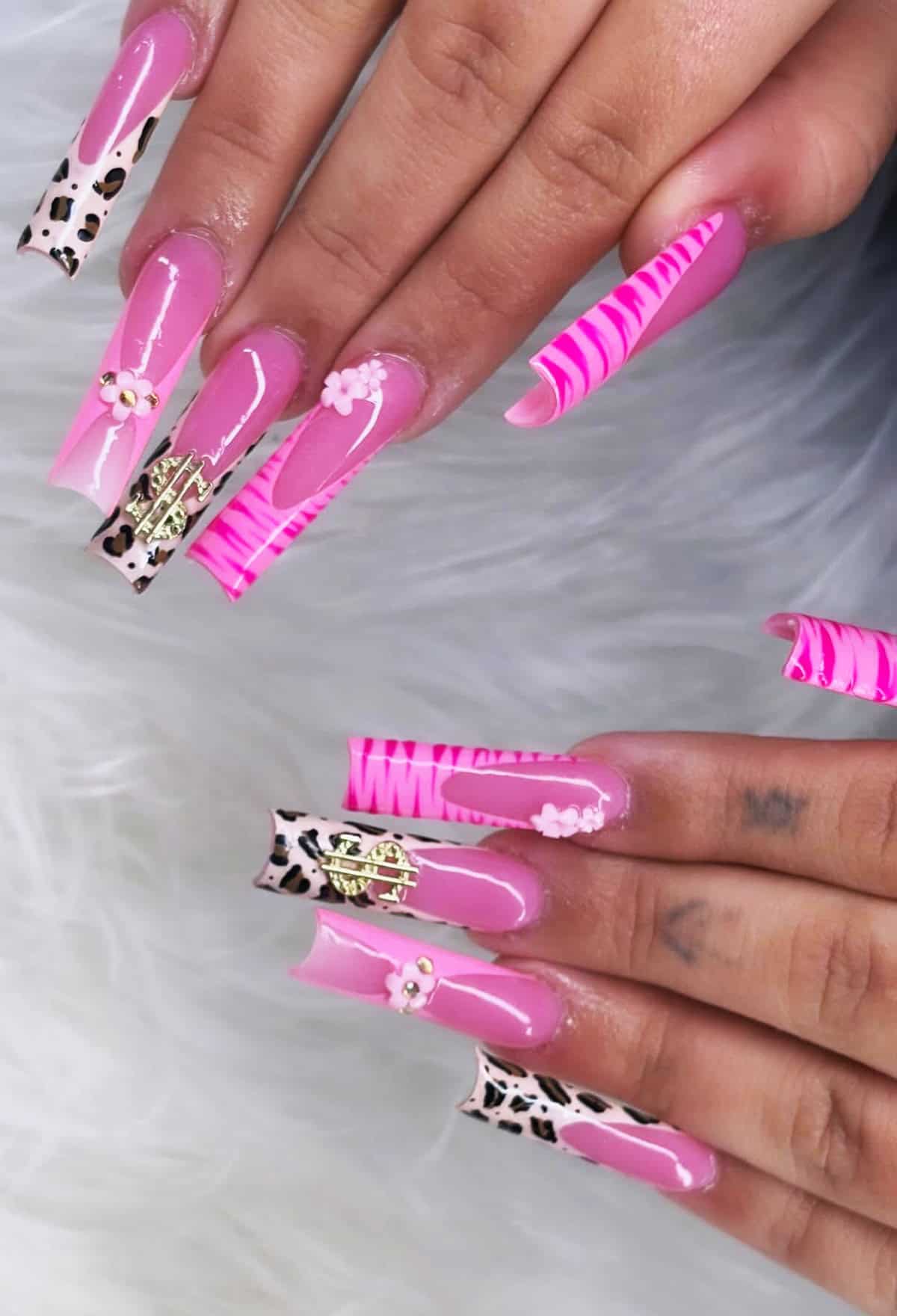 pink nails with zebra stripes and leopard print mixed design summer nails baddie nails for summer