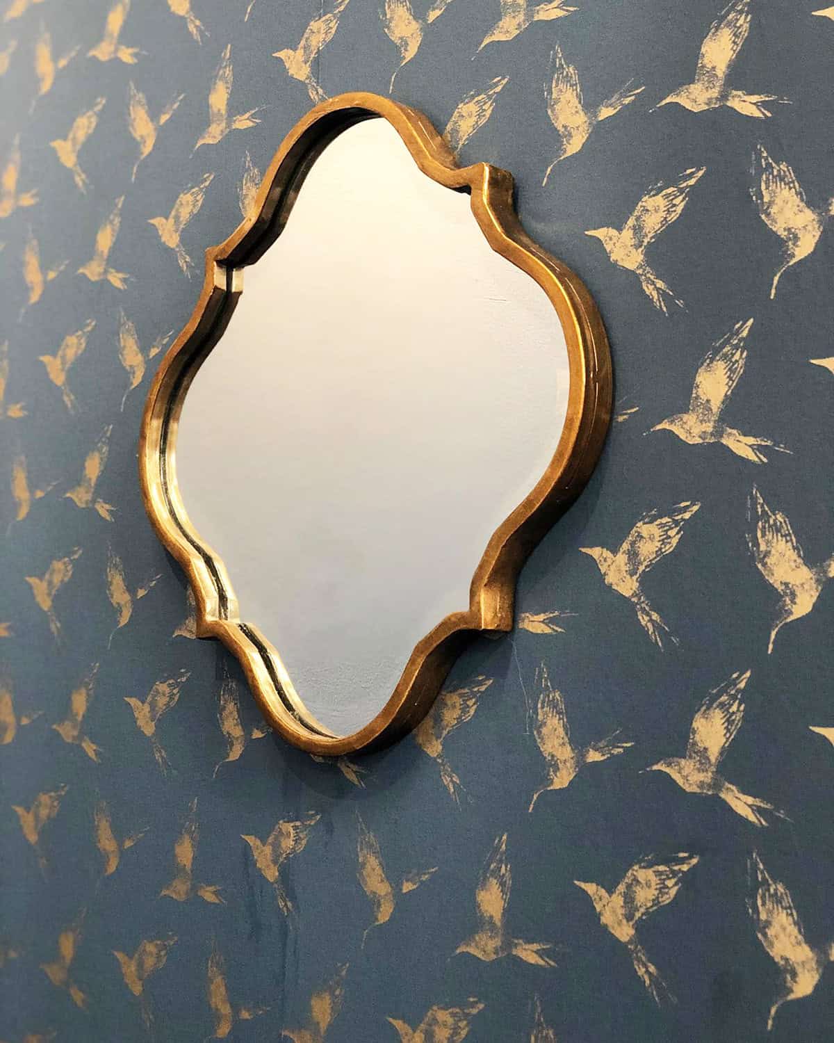 small bird pattern wallpaper in muted dark blue with gold mirror dark blue wallpaper ideas home decor