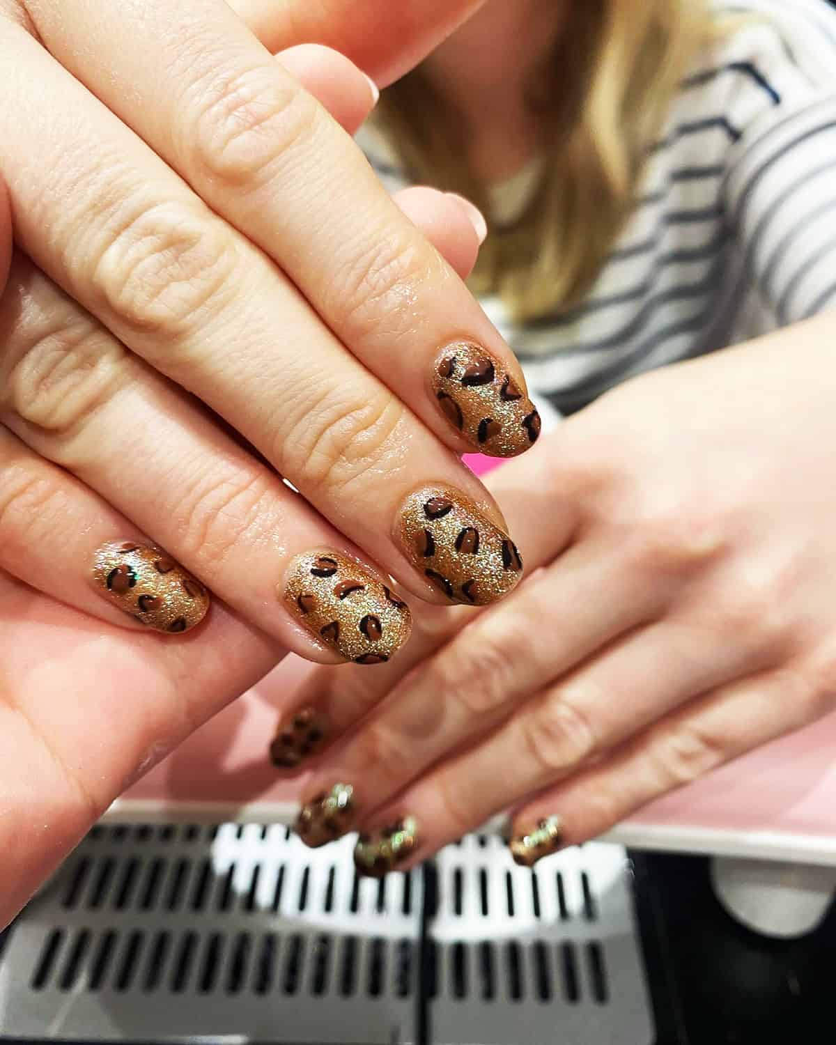 glitter base bold spots short leopard print nails