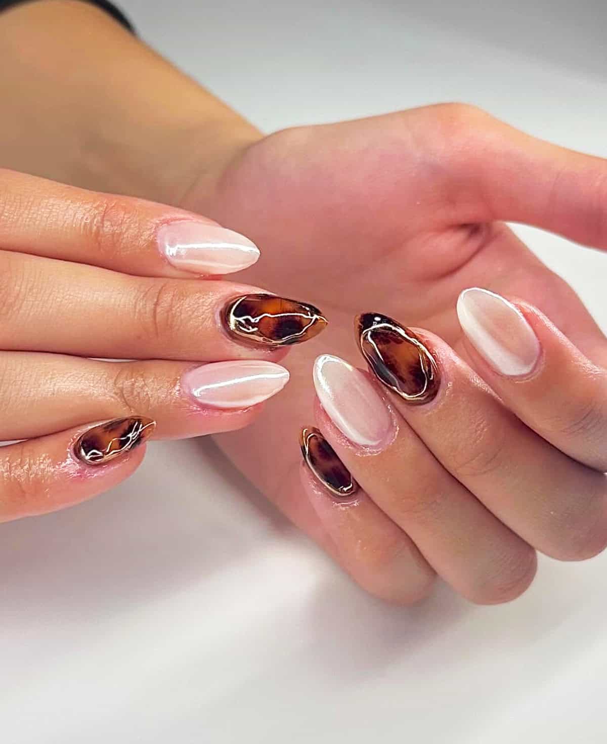 pearl almond tortoiseshell gold accent cheetah print nails