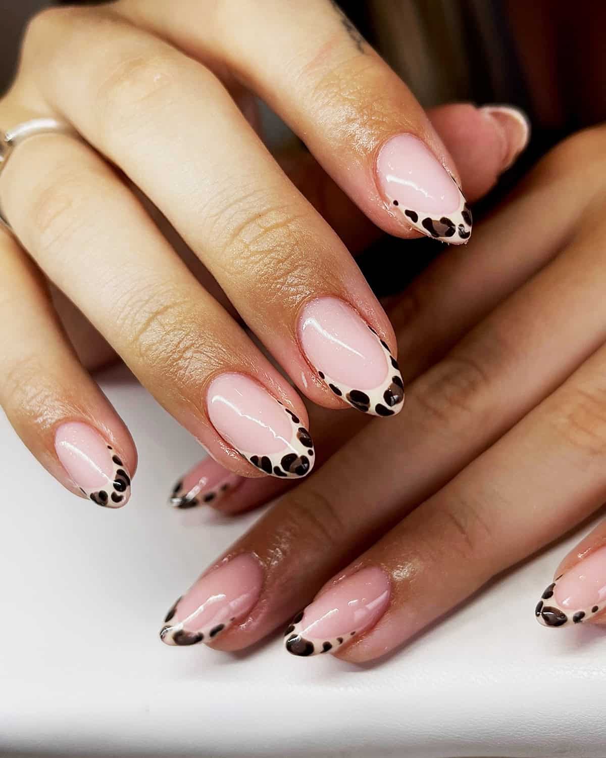 pink almond minimal tip black leopard print nails