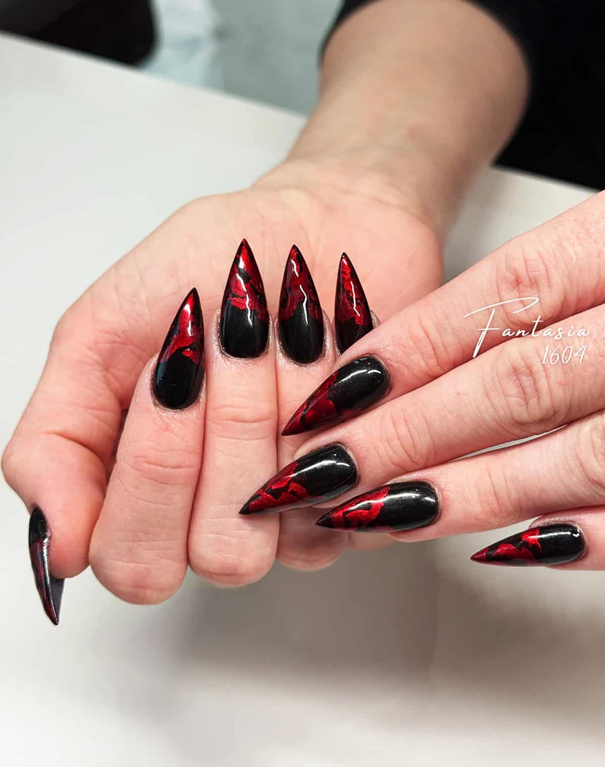 black lava textured red flame nails
