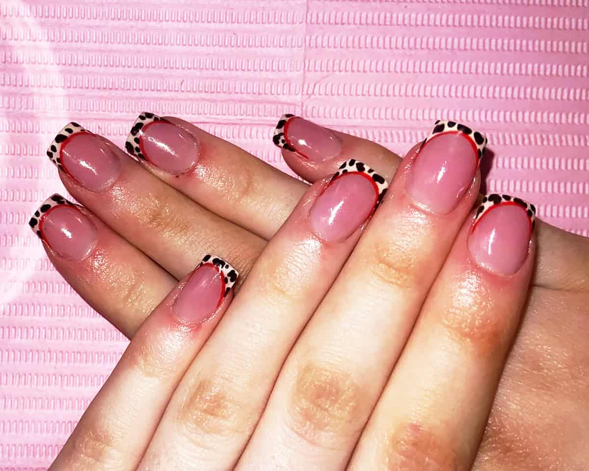 red outline tan tip short leopard print nails
