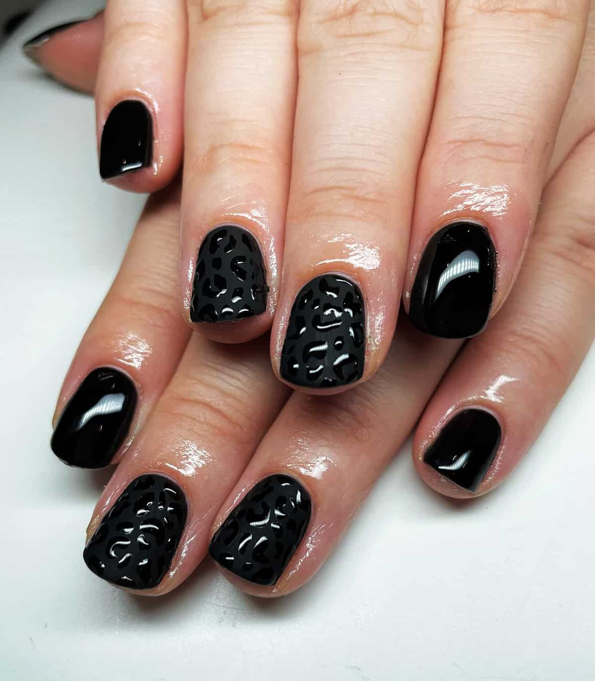short square tonal black leopard print nails
