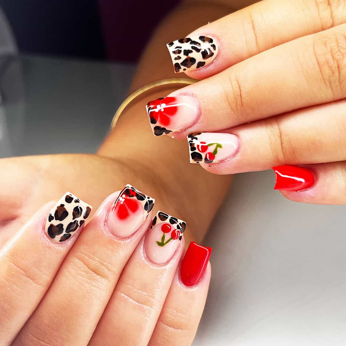 red cherry floral tip short leopard print nails