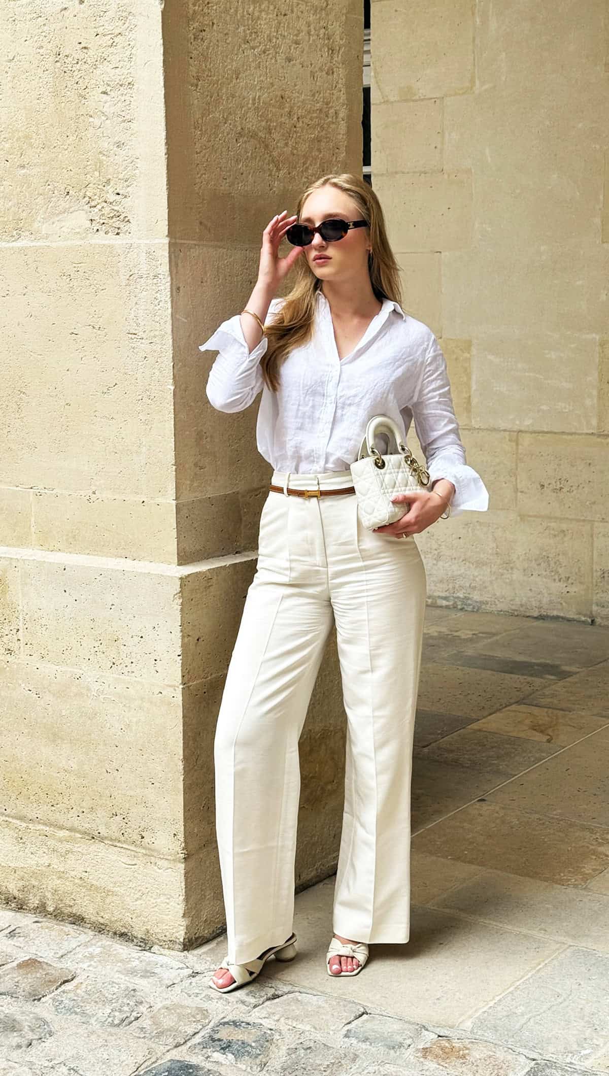 white linen long sleeve shirt tucked into white wide leg high waist trousers office attire for summer