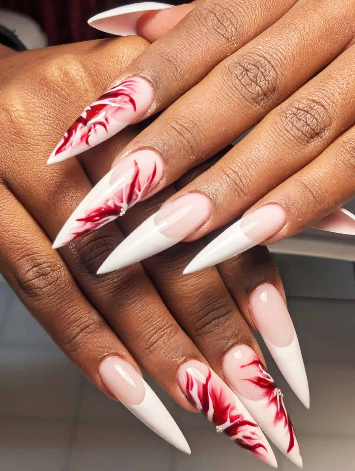 swirling red white flame nails