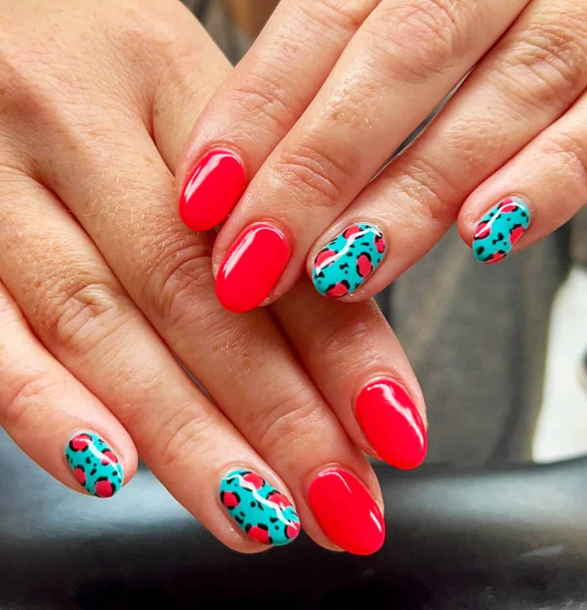 teal coral neon accent short leopard print nails
