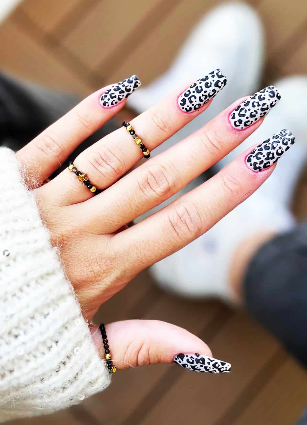 white coffin pink trim black leopard print nails