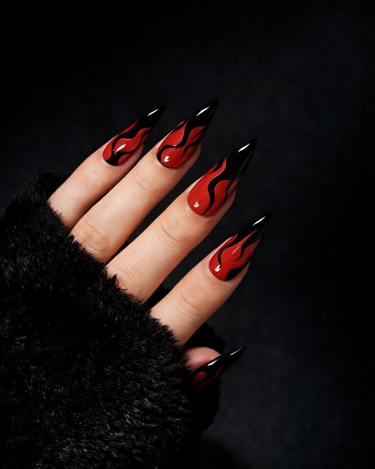 black stiletto red flame nails
