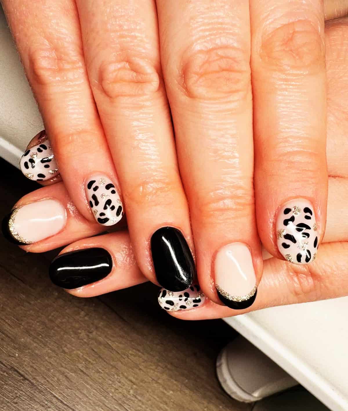 taupe almond alternating black leopard print nails
