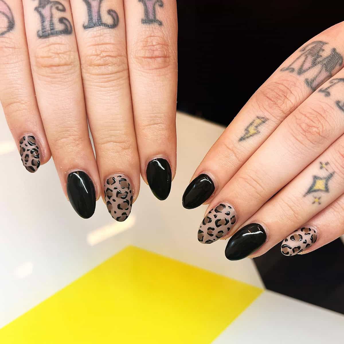 taupe almond alternating black leopard print nails