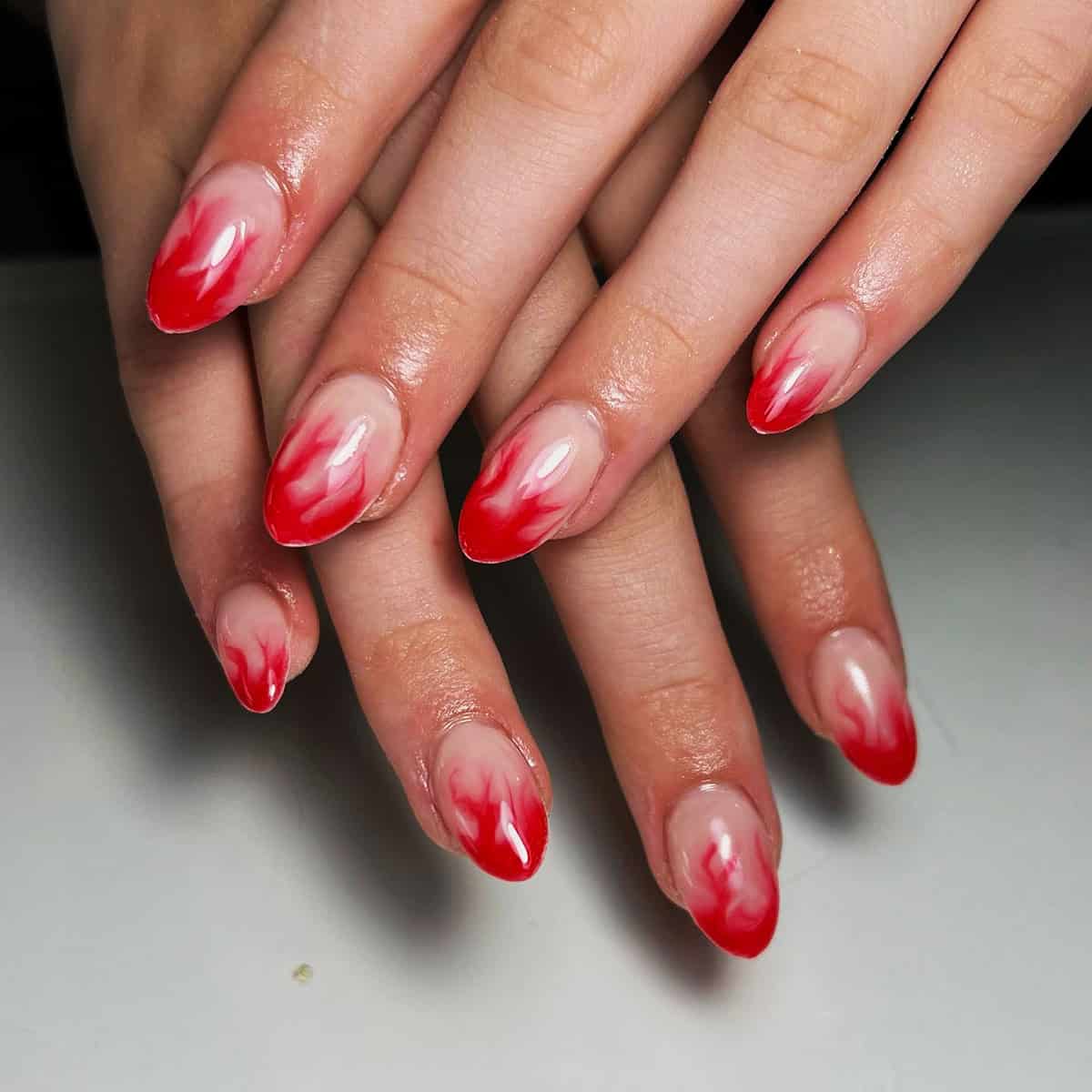 soft faded red flame nails
