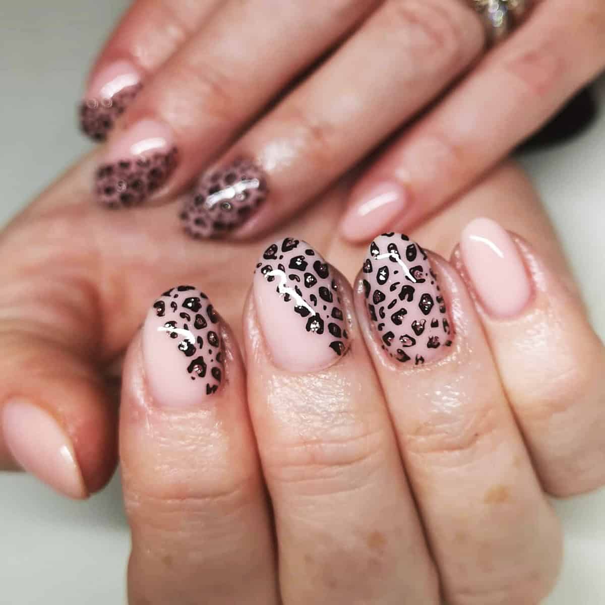 short pink metallic accent black leopard print nails