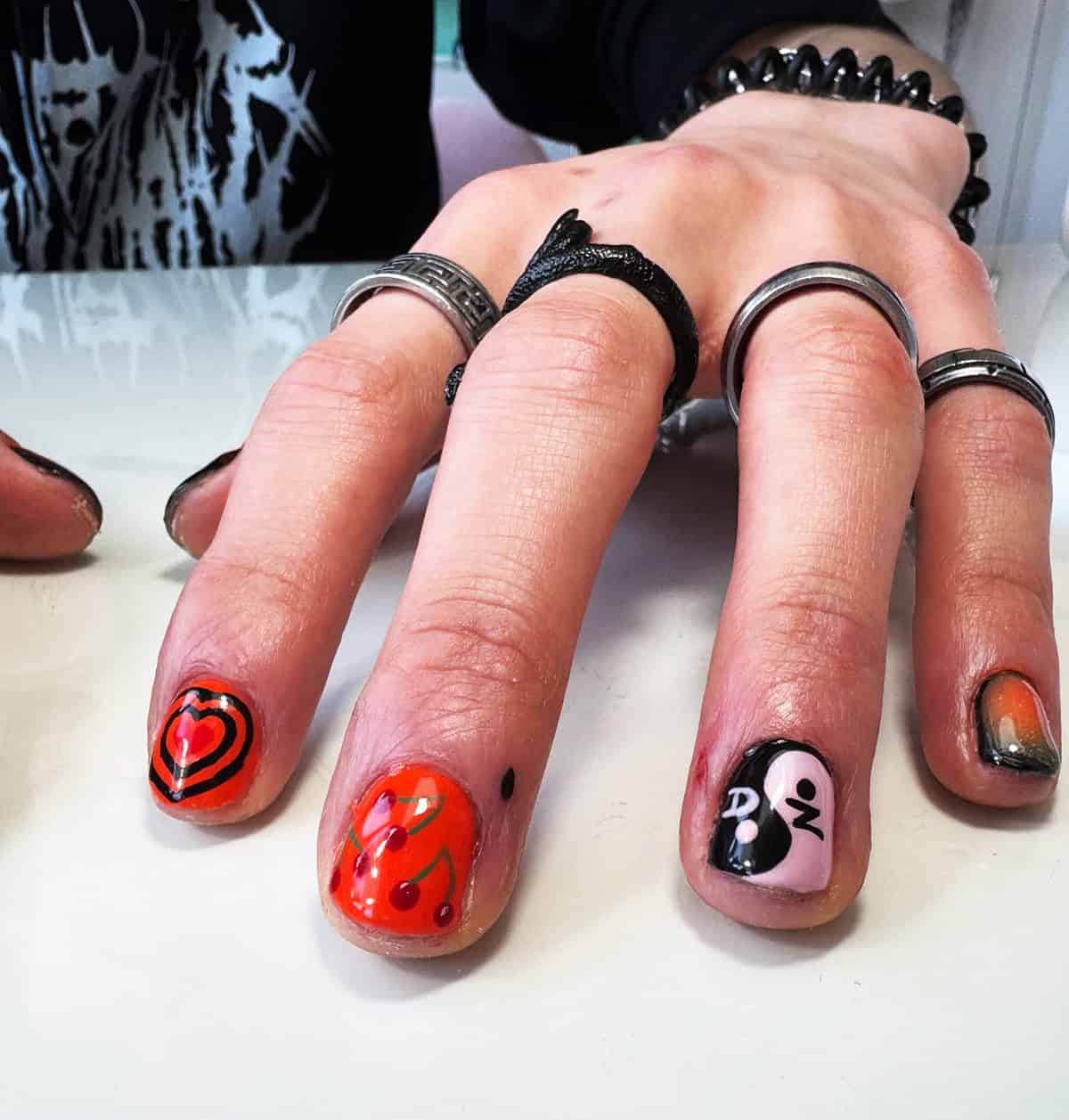 red graphic mixed men's nails