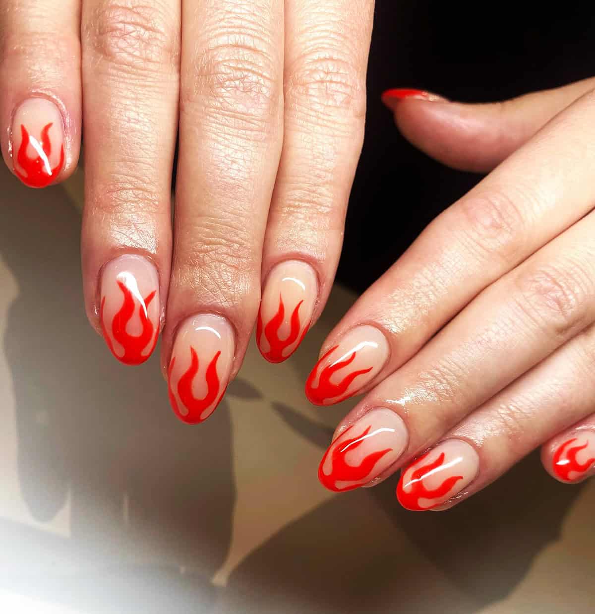 clean defined red flame nails