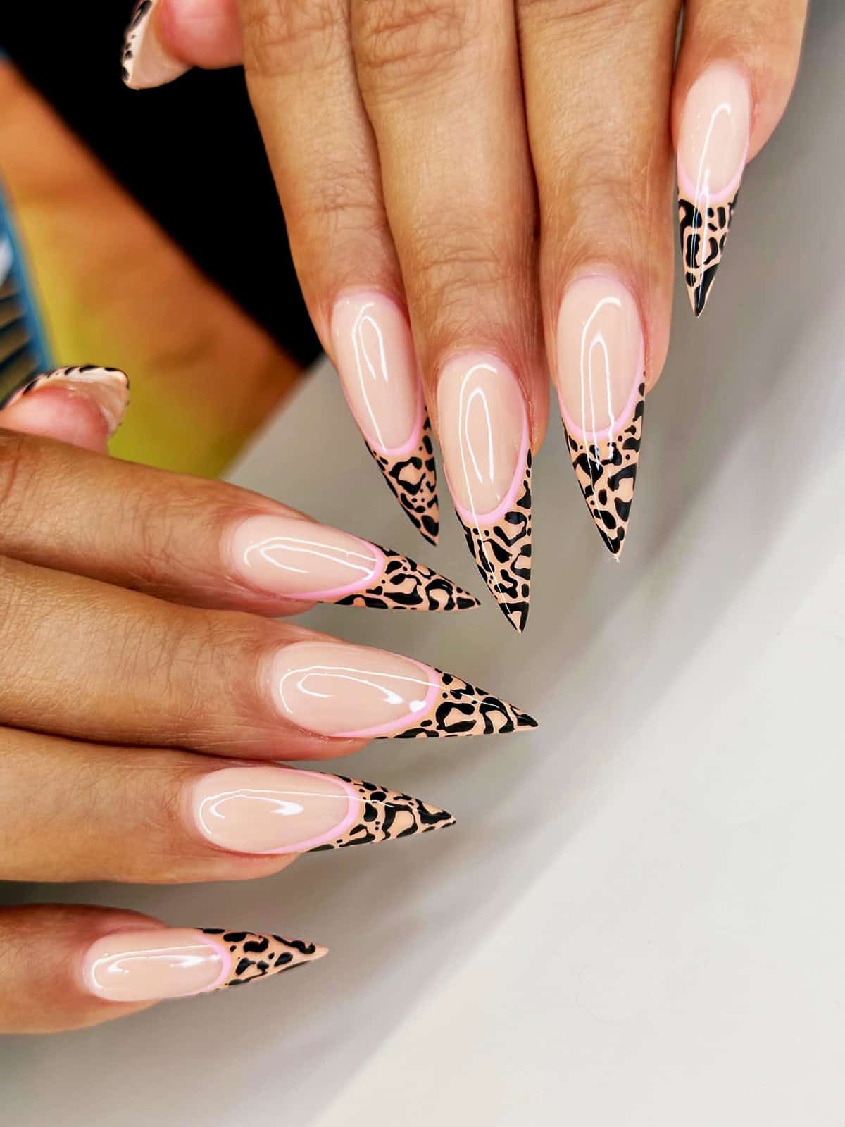 long stiletto cheetah tips pink outline cheetah print nails