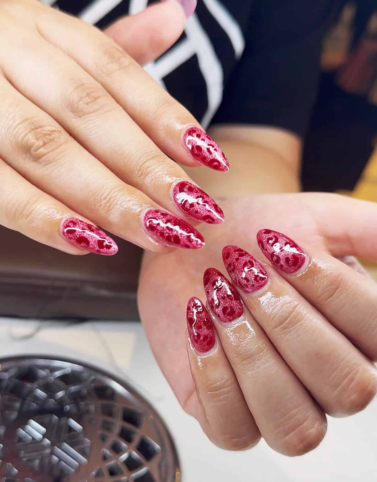 red glitter tonal cheetah stiletto cheetah print nails