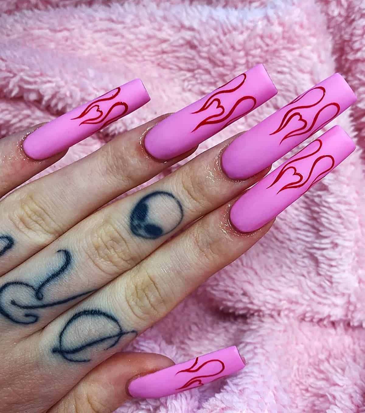 matte pink outlined red flame nails