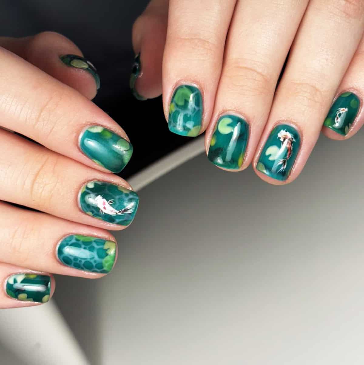 teal koi pond men's nails