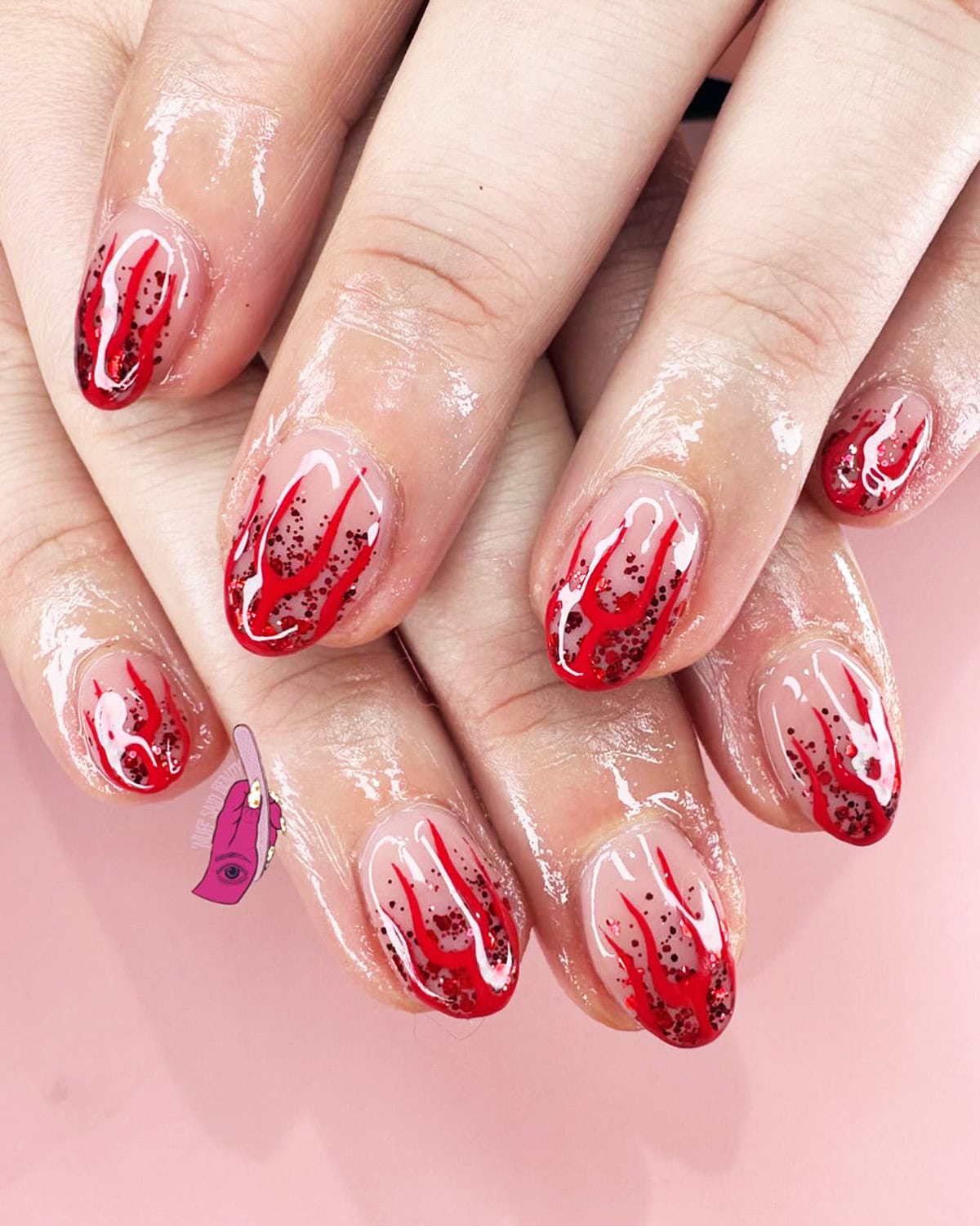 glitter scattered red flame nails