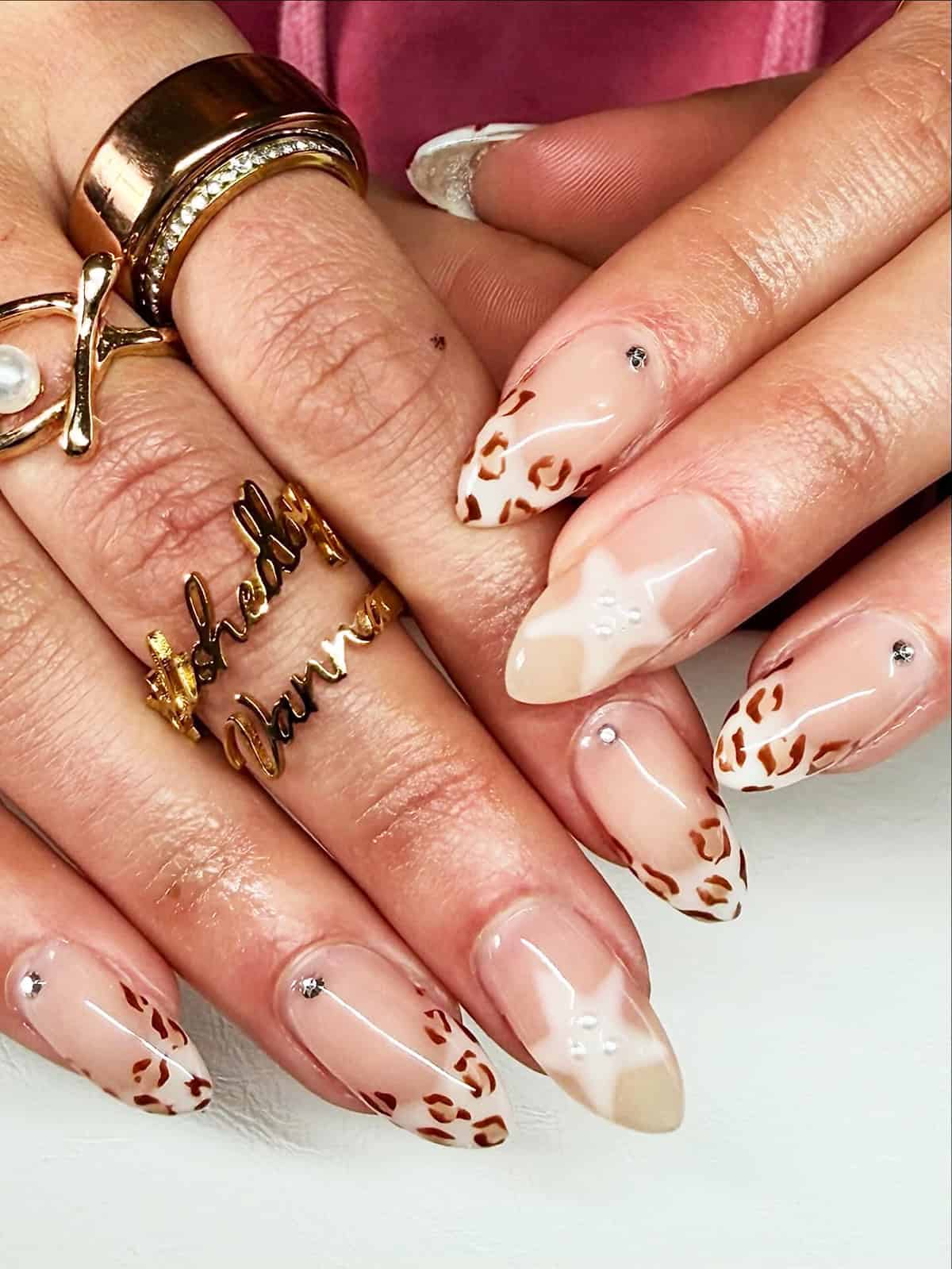 nude almond cheetah gem accents cheetah print nails