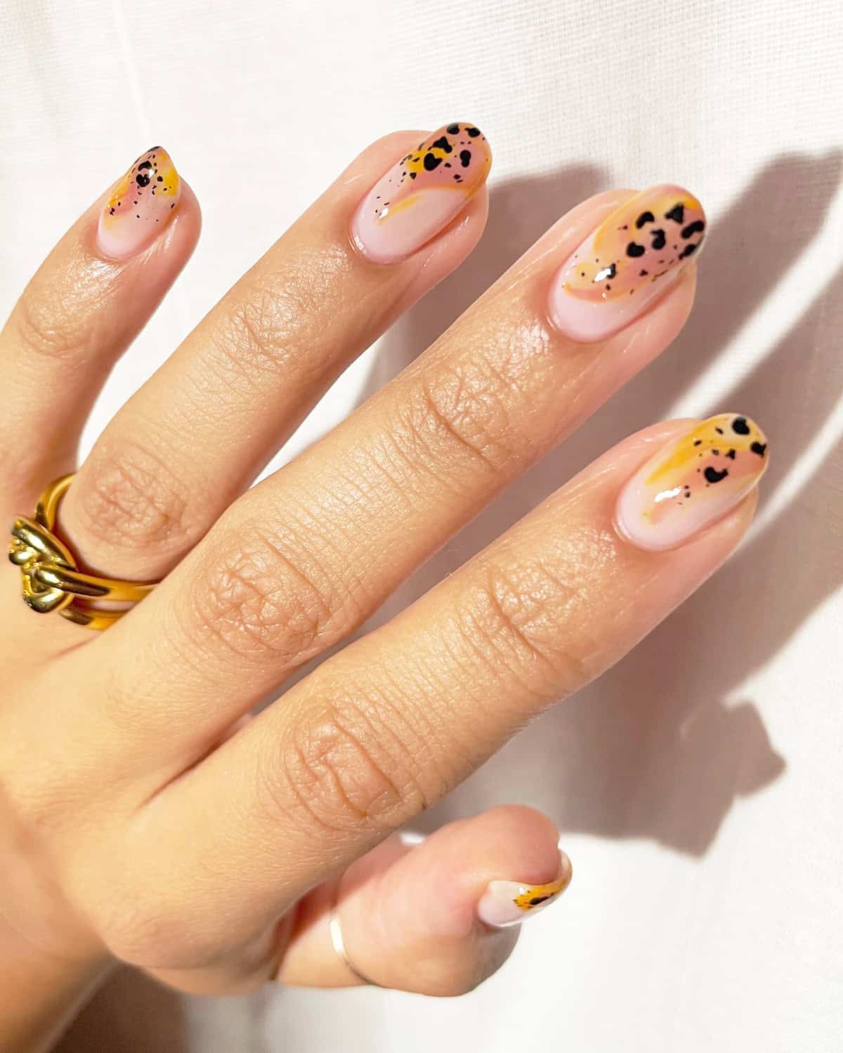 yellow peach abstract tip short leopard print nails