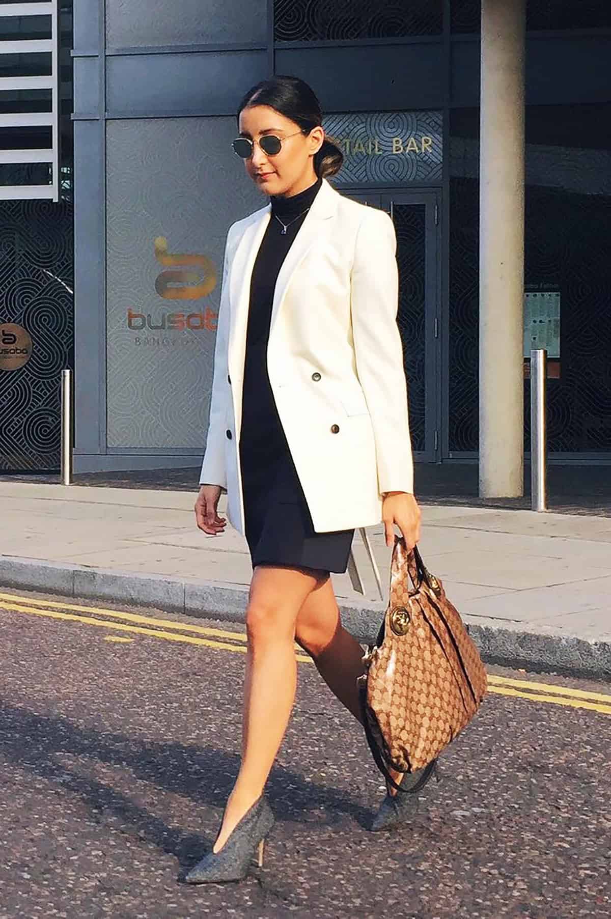 white blazer black turtleneck dress office attire for corporate women