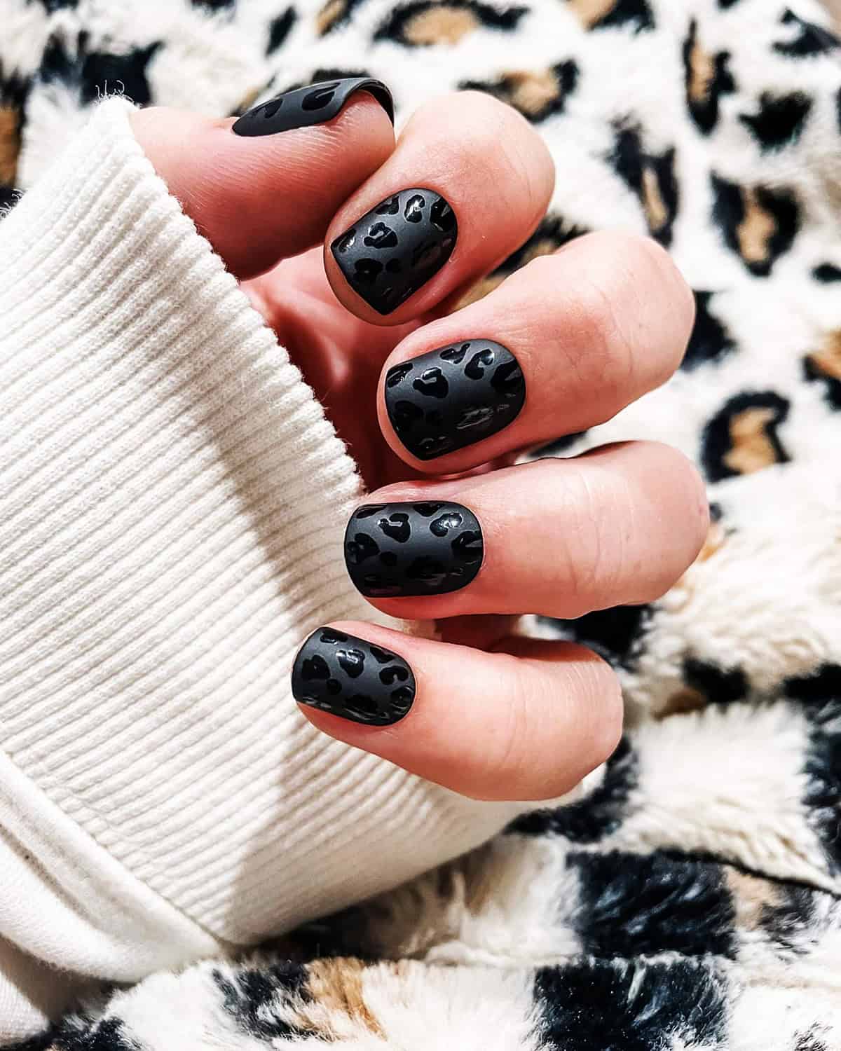 short matte tonal black leopard print nails