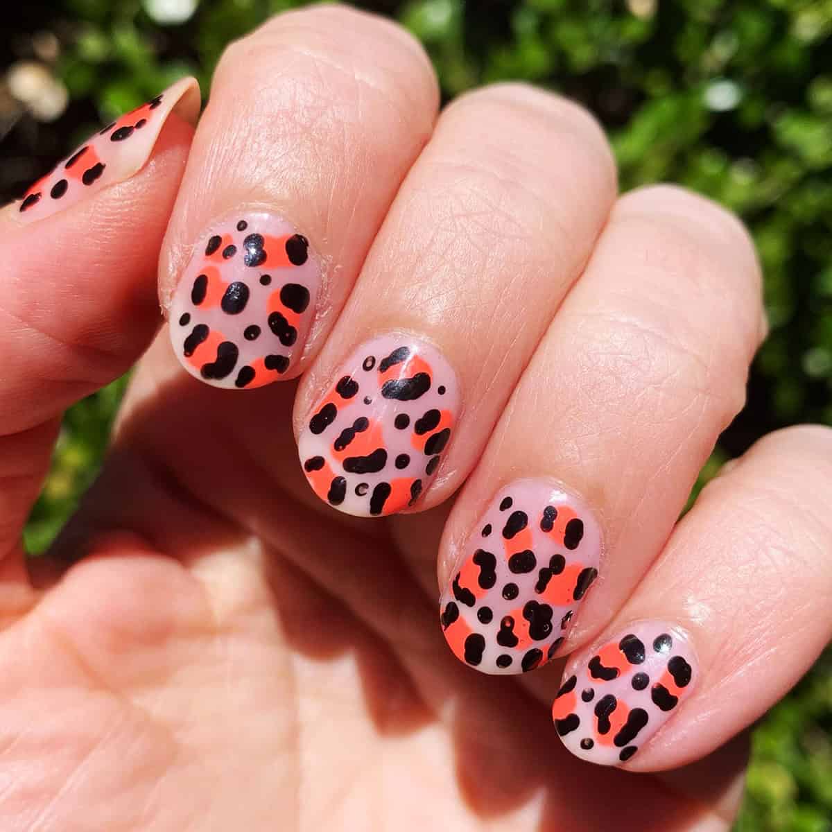 coral red bold spots short leopard print nails