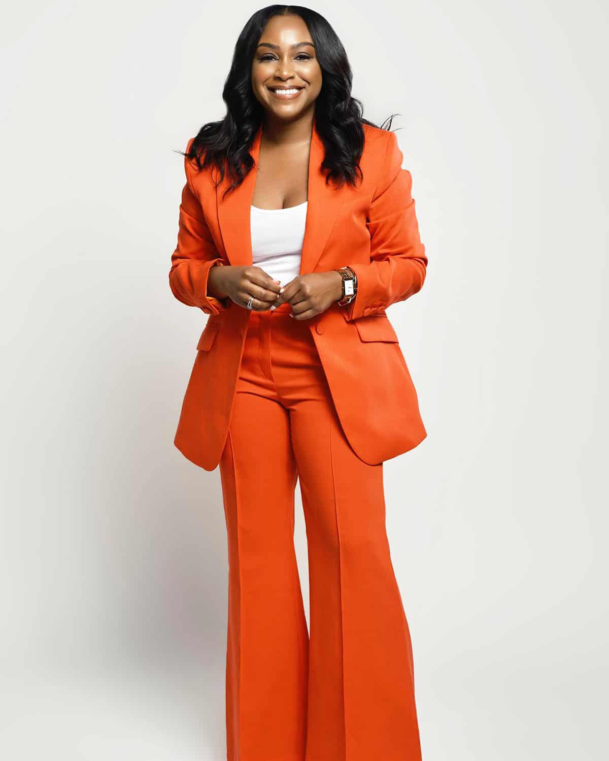 orange wide-leg suit with a white cami underneath office attire for summer