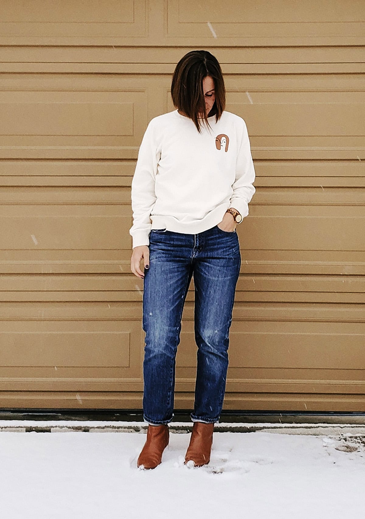 cream sweatshirt dark straight jeans for casual friday