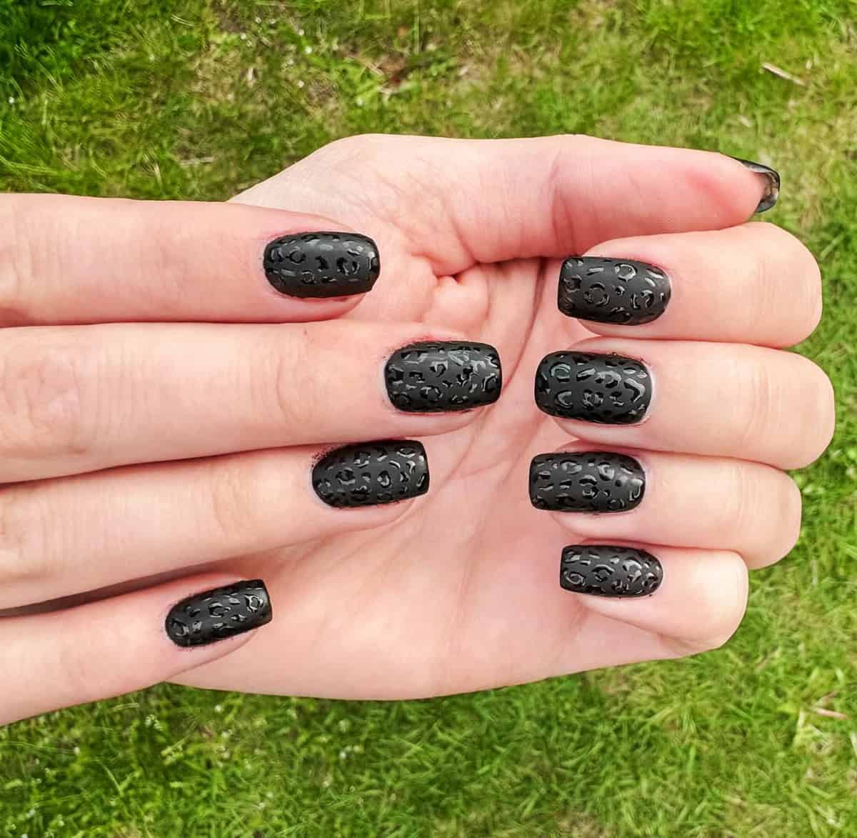 short square dark tonal black leopard print nails