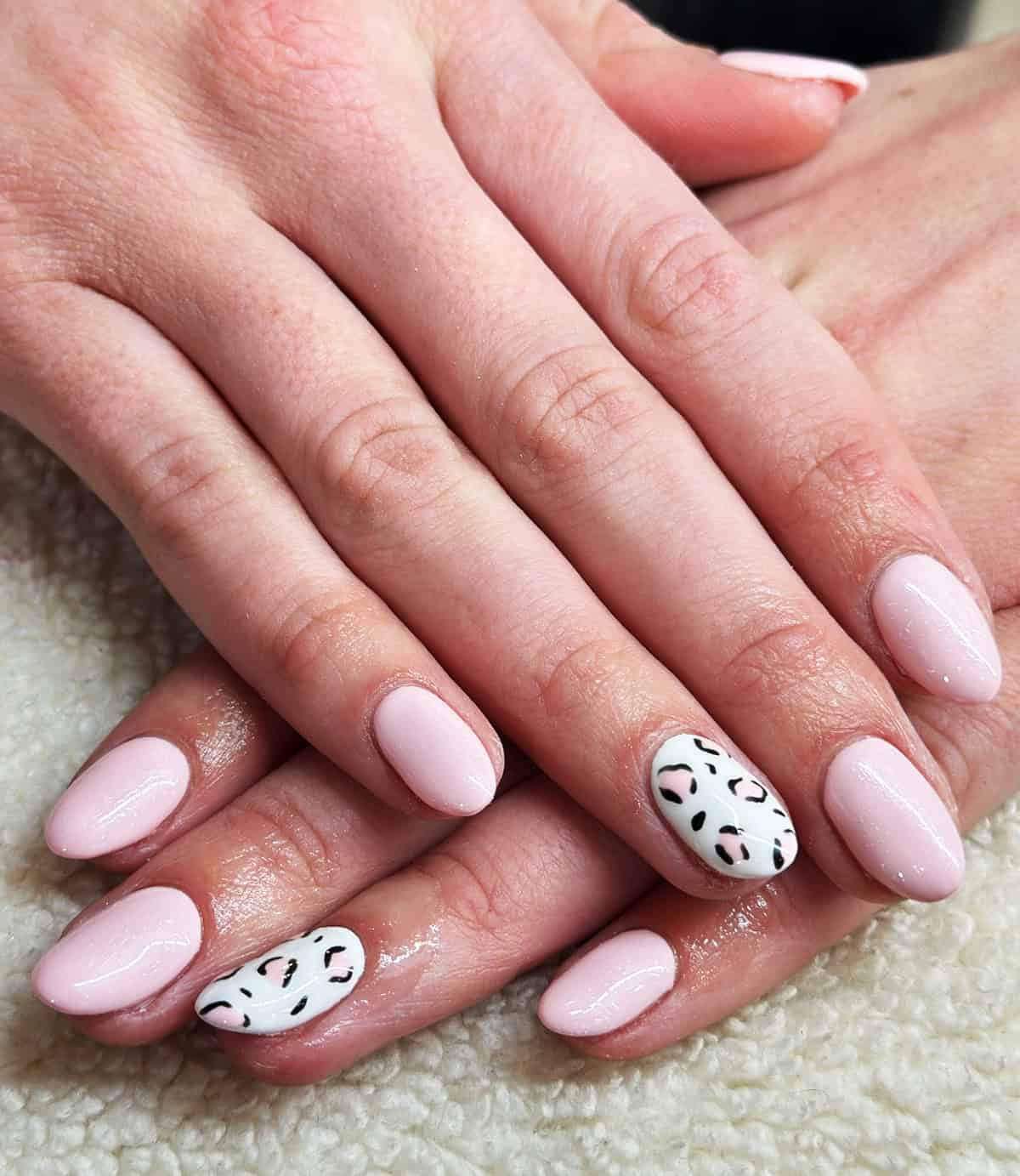 baby pink white accent short leopard print nails