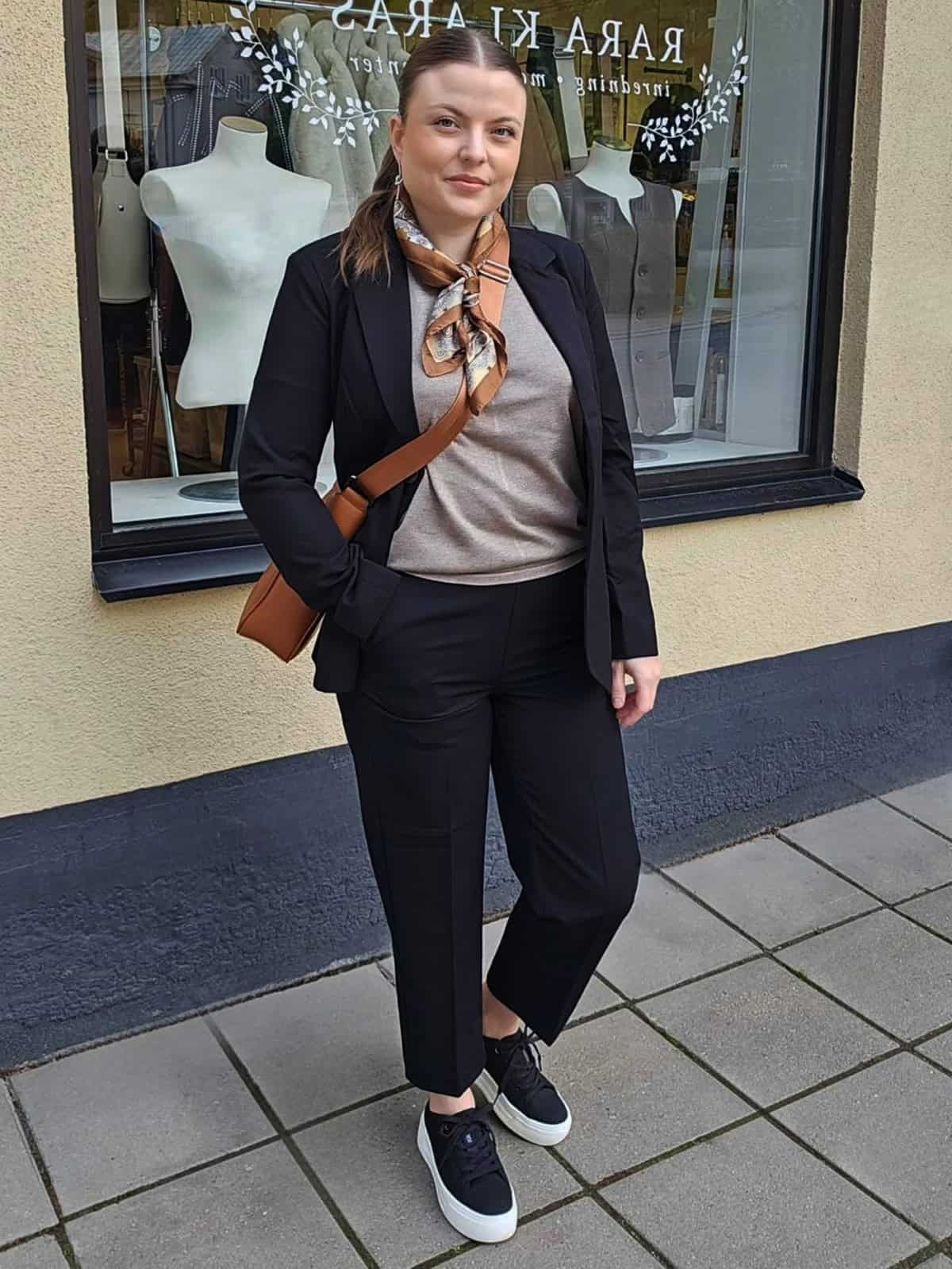 sneakers styled with tailored clothing