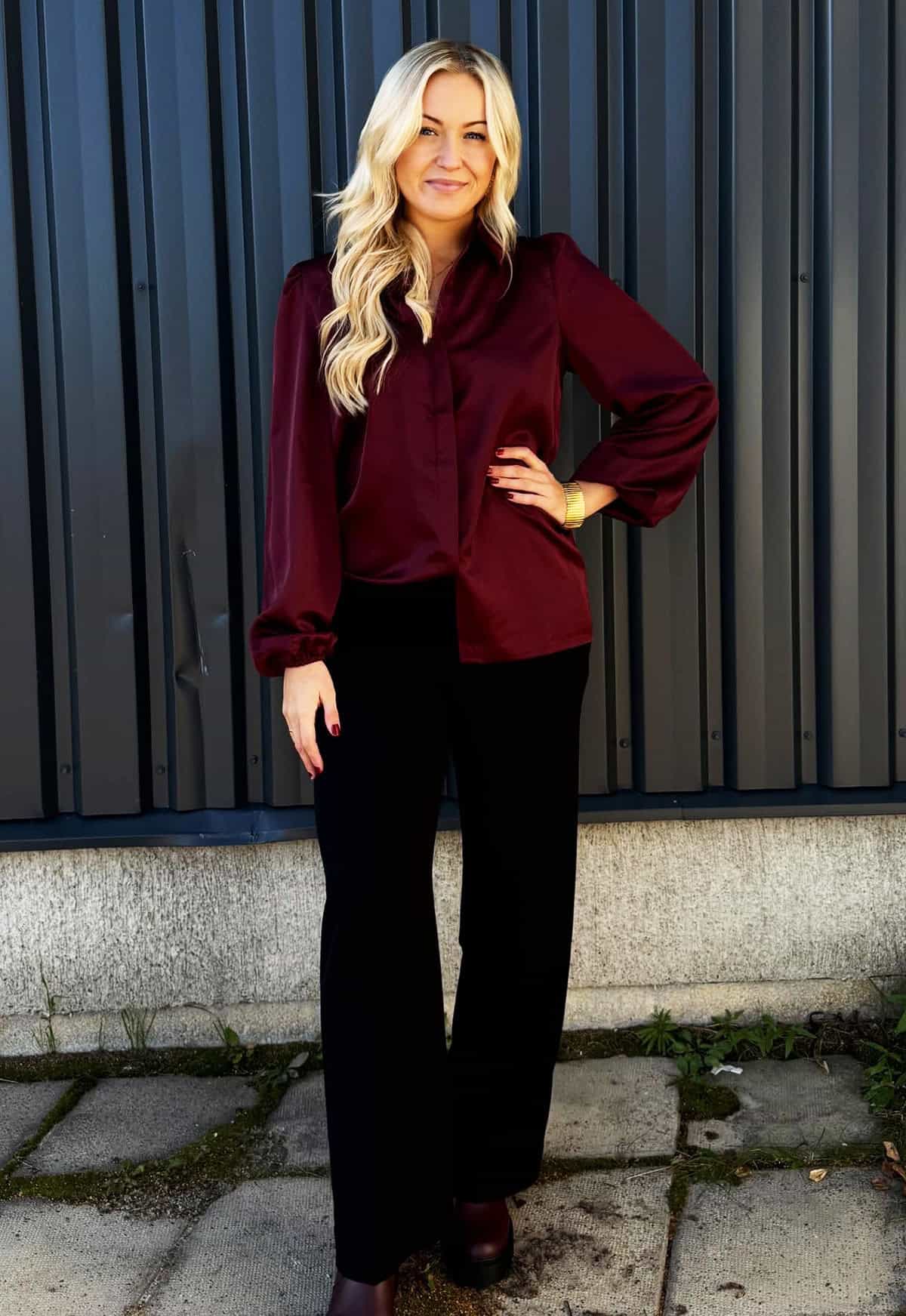 tailored trousers paired with a satin-style blouse