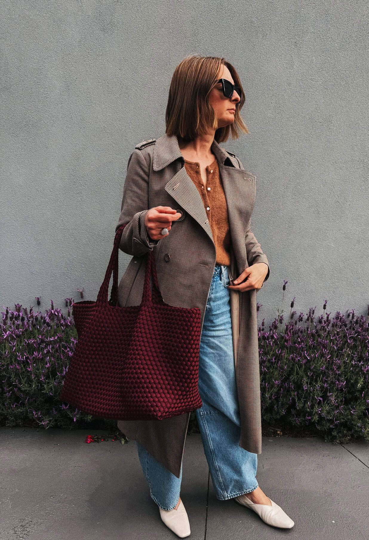 herringbone coat styled with jeans for a polished work look