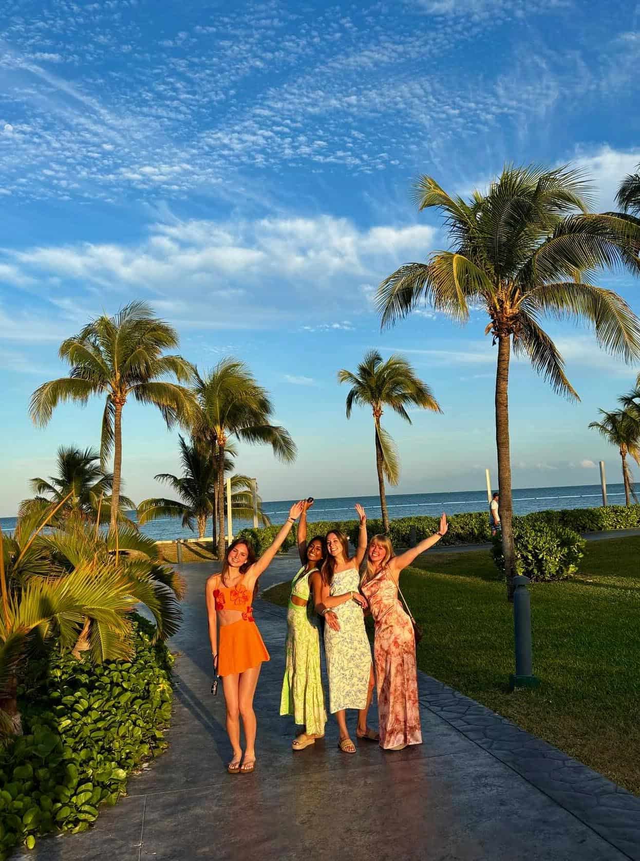 4 women wearing cancun outfits