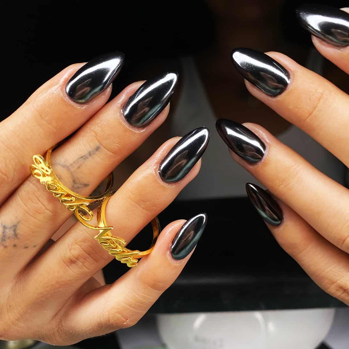 almond nails with ultra reflective mirror black chrome finish black chrome nails