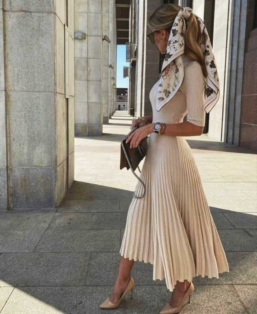 sand colored pleated skirt and sweater, luxury summer outfits