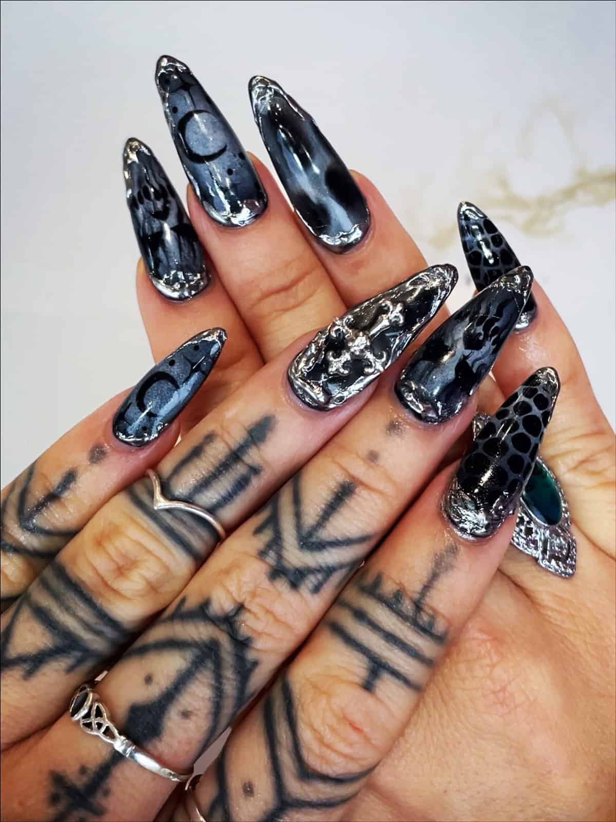 dramatic marbled black chrome nails with silver metallic accents black chrome nails