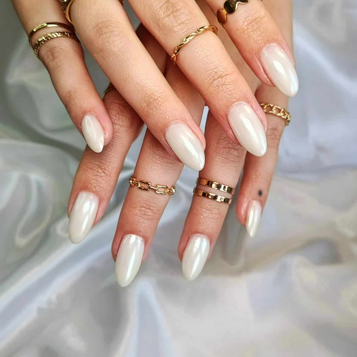 almond nails with creamy glossy white chrome finish white chrome nails